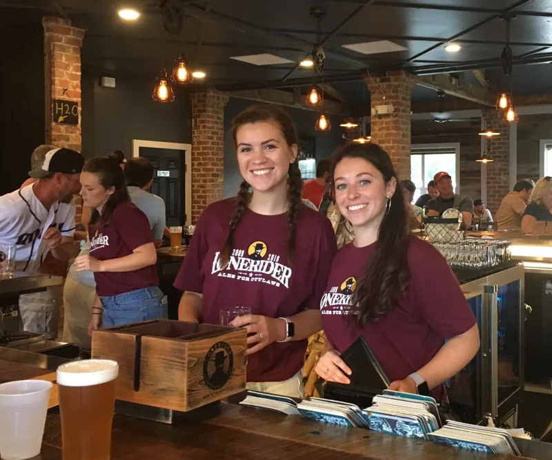 The Lonerider crew behind the bar at the Wake Forest Hideout