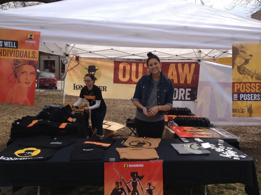 Setting up the merch tent before the gates open