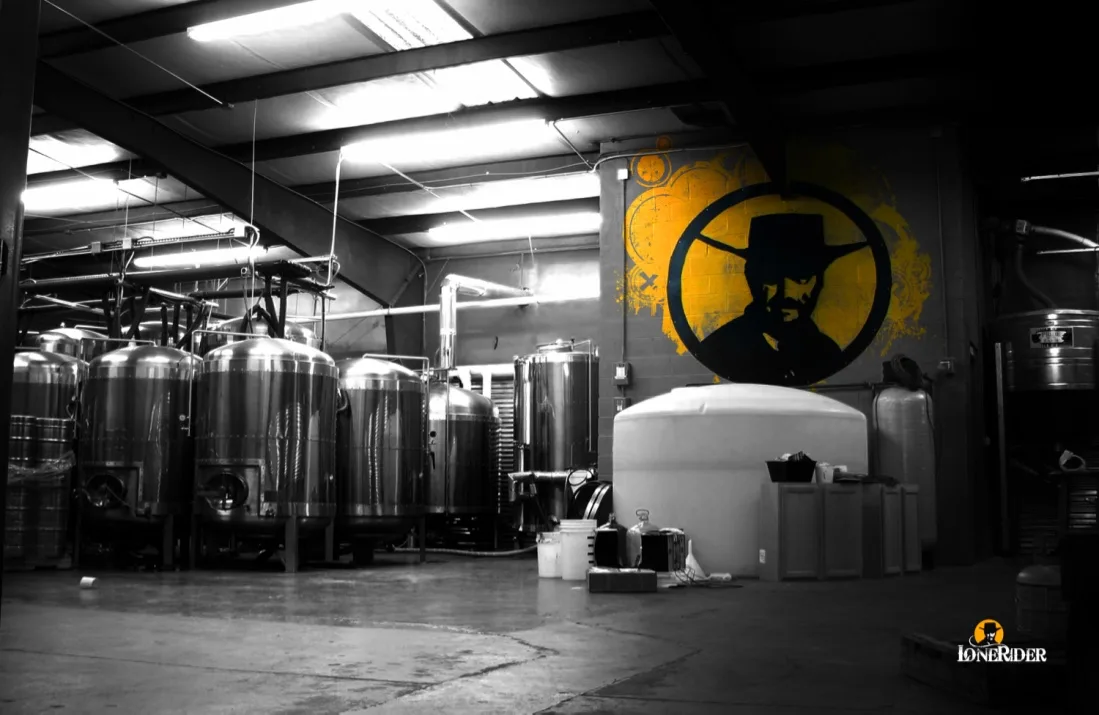 Brewing tanks under the Lonerider outlaw, painted on the wall